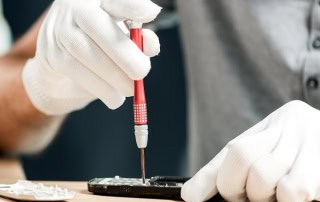 Apple technician fixing iPhone
