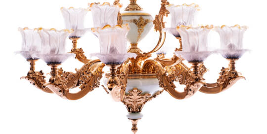 Intricate antique chandelier with gold accents and frosted glass shades, elegant lighting fixture ideal for luxurious interiors and classical decor styles.