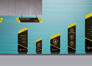 Modern airport signage with directions to food court, ATM, and various amenities, featuring digital display panels with icons for metro, bus, taxi, parking, disabled access, and shopping outlets.