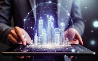 Futuristic digital cityscape hologram projected over a tablet, showcasing smart city technology, innovation, and digital urban development concepts.