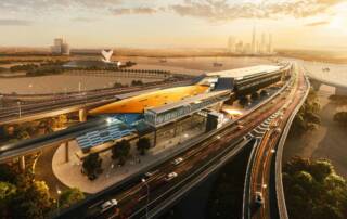 Futuristic transportation hub with elevated train station and highway overpass in an urban landscape during sunset. Modern infrastructure and city skyline in the background.