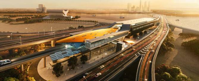 Futuristic transportation hub with elevated train station and highway overpass in an urban landscape during sunset. Modern infrastructure and city skyline in the background.