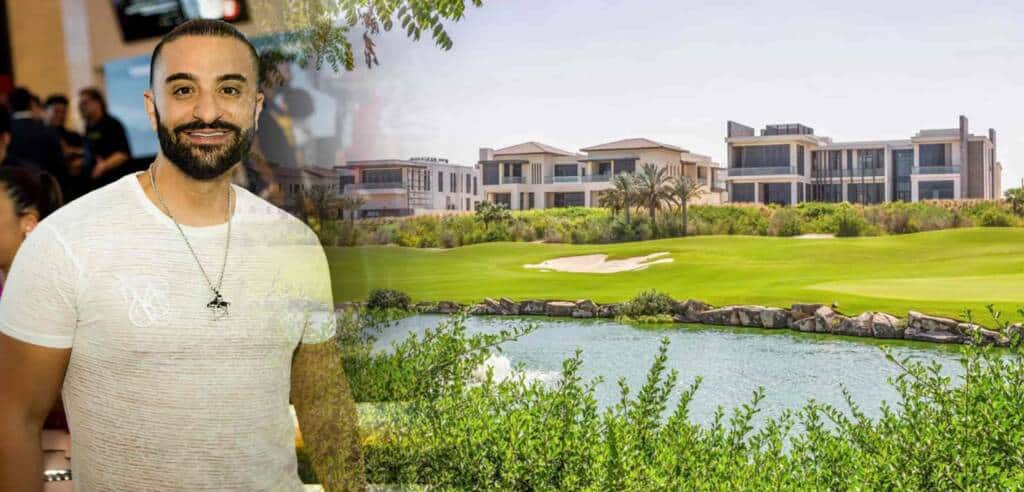 Luxurious modern residential buildings overlooking a golf course with lush greenery, water features, and palm trees, perfect for upscale living and leisure. Person smiling in the foreground at a social event.