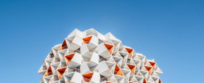 Modern hotel building with unique geometric balconies in Dubai, showcasing innovative architecture for digital marketing specialists in Dubai.